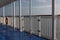 Gate and ring life preserver on a ferry ship exterior walkway