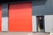 gate roller red high facade industrial unit warehouse building entrance delivery and Glass door