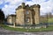 The Gatehouse. Derbyshire stone house on The Chatsworth Estate. Edensor, Derbyshire, England, UK. March 17, 2023.