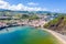 Gates Portao, idyllic beach Praia and azure turquoise Baia do Porto Pim, Horta town, Faial island, Azores, Portugal.