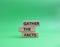 Gather the facts symbol. Wooden blocks with words Gather the facts. Beautiful green background. Business and Gather the facts