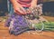 Gathering a bouquet of lavender. Girl hands hold bouquet