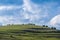 Gathering clouds over green meadow at springtime