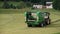 Gathering grass with hay baler machine