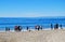 Gathering of people on seashore in Laguna Beach, Calfornia.