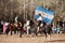 A Gaucho with Argentinian flag riding a horse in e