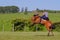 Gaucho riding on a wild untamed horse at a Criolla Festival in Uruguay, South America, also been seen in Argentina