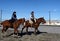 The Gauchos are riding along the road in Rio Grande.