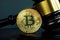 Gavel and Bitcoin coin. Crypto law and regulation of cryptocurrency