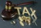 Gavel and cryptocurrency. Government regulation concept. Tax payment