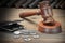 Gavel, Empty Purse, Coins, And Old Book On Wooden Table