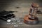 Gavel, Empty Purse, Coins, And Old Book On Wooden Table