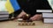 Gavel of judge and flag of Ukraine in court in hague