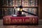 Gavel on LABOR LAW book symbolizes authority in legal labor matters.