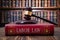Gavel on LABOR LAW book symbolizes authority in legal labor matters.