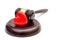 Gavel with red heart on white