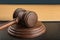 Gavel and sounding block close up. Wooden hammer. Justice and law concept