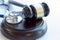 Gavel and stethoscope. medical jurisprudence. legal definition of medical malpractice. attorney. common errors doctors