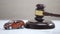 Gavel striking on sound block, car figure on table, property division, justice