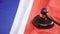 Gavel striking on sound block on flag of France, national court decision, order