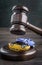 Gavel under collision of two toy cars on wooden table