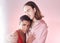 Gay, beauty and lgbtq people hug isolated on studio pink background in glow, pastel and creative art aesthetic. Fashion