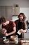 Gay couple goofying at the kitchen while making breakfast
