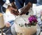 Gay Couple Hands Cutting Wedding Cake