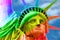 Gay equal rights and LGBT sexual freedom in America concept with the statue of liberty covered in the rainbow colors. LGBTQ