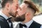 Gay kiss on wedding. Marriage gay couple tender kissing. Close up portrait of gay kissed. Portrait of gay couple in love