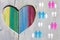 Gay and lesbian couples and families on wooden background with multicolor rainbow heart