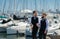 Gay man groom at wedding. Same-sex marriage and love concept. Happy gay couple on wedding near yacht boat. Romantic and