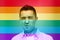 Gay man wrying over rainbow flag background