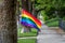 Gay Pride Flag Along Sidewalk in Neighborhood