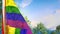 Gay Pride hanging flag with trees and sky for anthem day - object 3D illustration