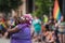 A Gay Pride Participant holds a dog