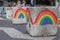 Gay pride rainbows painted on anti-terrorism concrete blocks