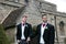 Gay wedding, grooms leave village church after being married with big smiles and holding hands