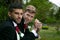 Gay weddings, grooms, couples pose for pictures after their wedding ceremony in churchyard