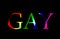 Gay word in rainbow colours isolated on black background. Homosexuality concept