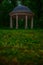 Gazebo dusk park outdoor vertical photography with blurred green grass foreground space