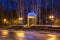 Gazebo with electric garlands in city park at winter