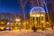 Gazebo with electric garlands in city park at winter