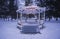 Gazebo with lights on in fresh snow in New Jersey at Christmas time