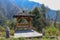 Gazebo made of bamboo logs, with a roof of palm fibers on the edge of a valley in the mountains. A place to relax and rest.