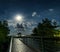 Gazebo and moon in water\'s reflection. Night landscape