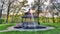 Gazebo in a park with trees around.