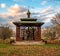 A gazebo with a sculpture in the St. Seraphim Monastery