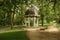 Gazebo with a spring in the park