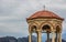 Gazebo stone European medieval building object in observation yard space with highland mountain background landscape in gray